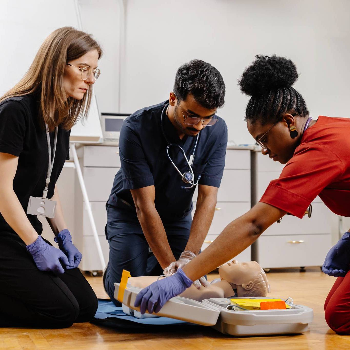 EMS crew reviewing certifications on a tablet
